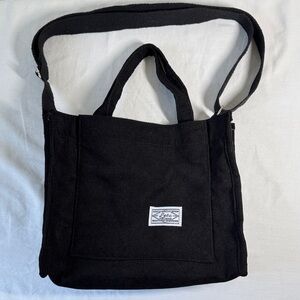 Stylish Black Corduroy Tote Bag. Webbing Handles and adjustable strap.